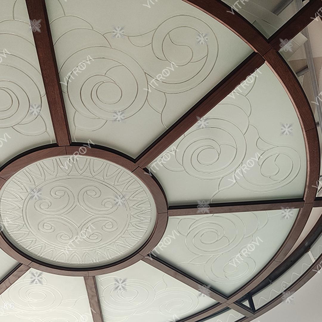 Engraving on a stained glass ceiling